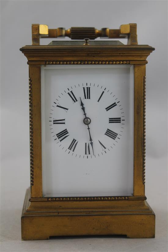 An early 20th century French gilt brass hour repeating carriage clock, 6.5in.